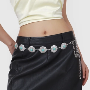 Bohemian silver metal waist chain with vintage turquoise stones shown on a model
