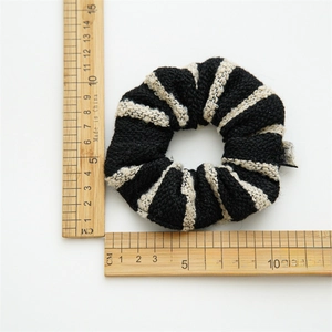 French vintage striped tweed scrunchie displayed with a ruler for size reference