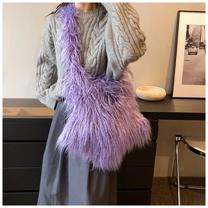 Chic purple plush crossbody bag worn by a model in a minimalist lifestyle indoor setting