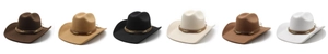 Row of colorful wide brim felt cowboy hats with decorative leather bands in studio