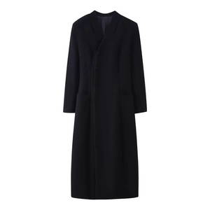 Women's black wool coat with stand collar and side buttons featuring padded shoulders