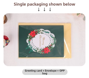 Detailed view of 3D Christmas card with floral wreath design and matching envelope