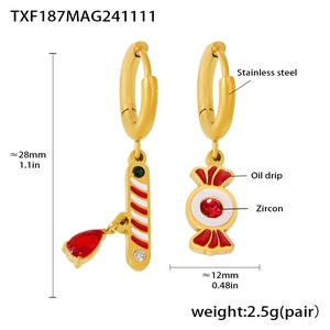 Detailed view of Christmas candy cane earrings in gold stainless steel with red zircon