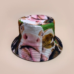 Detail of colorful cow print bucket hat featuring high-quality stitching and fabric texture