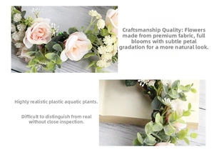 Close-up of pink fabric roses and faux greenery on a bridal floral headband crown