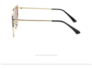 Side view of metal cat eye sunglasses featuring slim gold temples and black tips