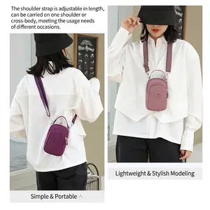 Mini nylon crossbody phone bag with adjustable shoulder strap in purple and pink