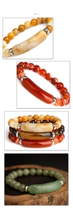 Macro shot of stretch beaded bracelets with tiger eye, agate and silver tube beads