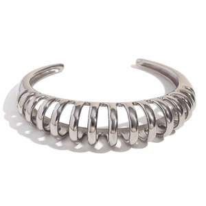 Polished silver stainless steel open bangle featuring a hollow ribbed wave design