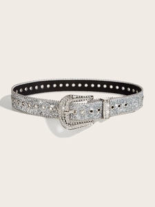 Close-up of sparkling silver rhinestone belt with detailed buckle on white background