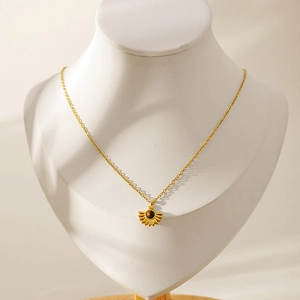 French vintage sun flower necklace with brown gemstone on elegant mannequin display
