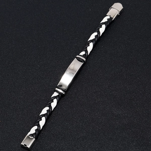 Close-up of braided leather bracelets with polished rectangular stainless steel plates