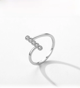 Macro detail of S925 sterling silver ring featuring a five-zircon stone horizontal setting