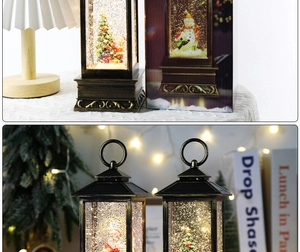 Close-up of vintage bronze Christmas lanterns with Santa scenes and warm glowing lights