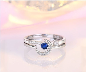 Adjustable crescent moon silver ring with deep blue gemstone and sparkling crystals