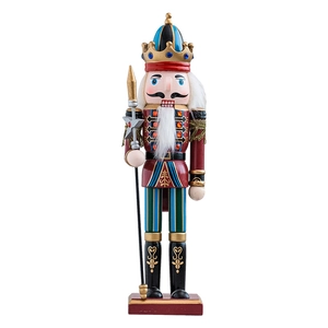 Traditional wooden nutcracker soldier king with red uniform and golden spear on white background