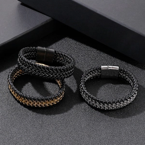 Three braided leather and metal chains with magnetic clasps on a textured black surface