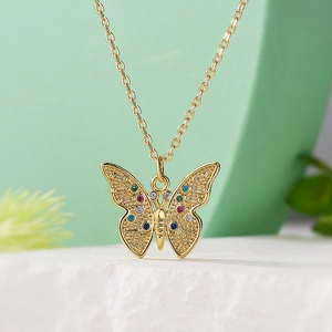 Gold butterfly pendant necklace with multi-colored stones on a stylish O-chain