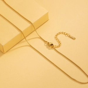 Golden stainless steel box chain necklace with lobster clasp and S-STEEL mark