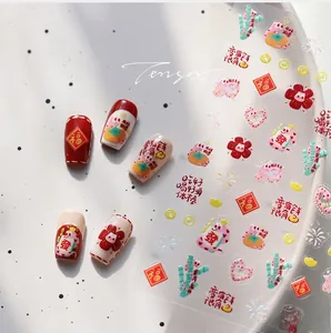 Detailed view of Chinese New Year nail stickers featuring lucky carp and red koi designs