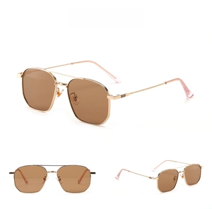 Detailed views of gold metal aviator sunglasses with brown gradient lenses