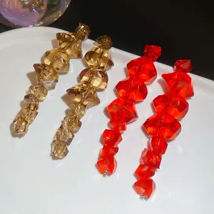Irregular acrylic ice cube drop earrings in amber and red with faceted geometric beads