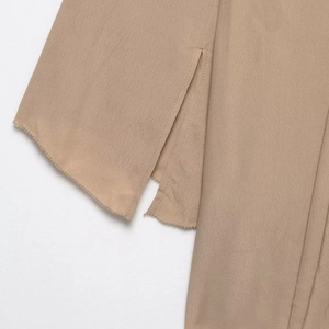 Short khaki chiffon dress with lapel collar, side slits and fringe hem details