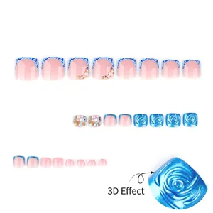 3D press-on toe nails with light pink base, blue French tips, roses and pearls décor