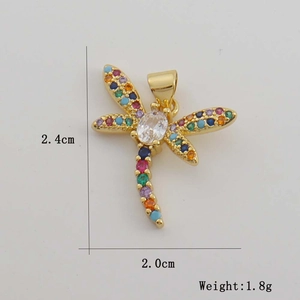Macro detail of gold plated dragonfly pendant with colorful zircon stones and dimensions