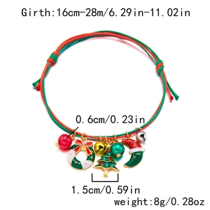 Detail of hand-woven Christmas bracelet with enamel tree, wreath, and bell charms