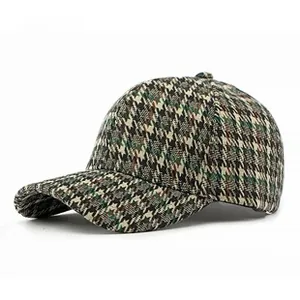 Λεπτομέρεια υφής μαλλιού με σχέδιο houndstooth σε ένα vintage καπέλο μπέιζμπολ