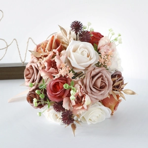 Artificial wedding bouquet with roses and champagne ribbons for bridal photography
