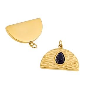 Detailed view of golden semi-circle pendant with blue teardrop stone and hammer texture