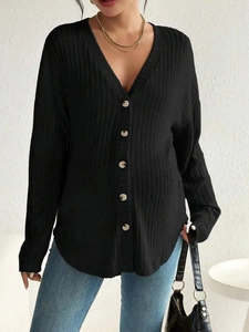 Detail of black V-neck maternity knit cardigan with wood-style buttons and ribbed texture