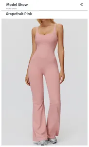 Front view of peach pink flared yoga jumpsuit with thin straps and V-cut waistline