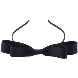 Macro detail of the double-layered black grosgrain ribbon bow on the elegant headband