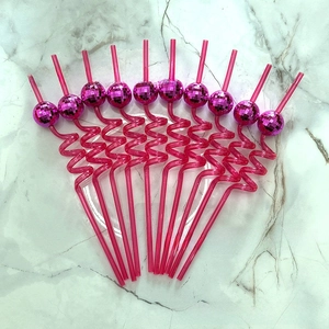 Detail of pink disco ball straws in a set of ten with shiny mirror reflective finish