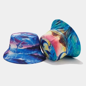 Reversible bucket hat featuring vibrant ocean dolphin and sunset graphic prints