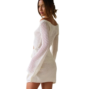 White knit hollow out beach cover-up dress shown from a stylish side-back view
