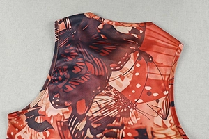 Detail of butterfly print texture and fine neckline stitching on sleeveless top