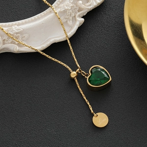 Golden titanium necklace with emerald heart pendant and Love engraved charm for women