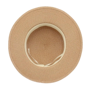 Detail view of woven straw hat interior with adjustable strap and beige sweatband