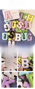 Detailed close-up of 5.5cm chenille letter patches with gold glitter embroidery edges