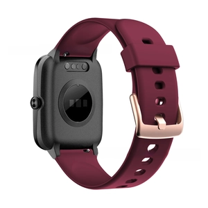 Detail of wine red silicone strap with rose gold buckle and heart rate monitor on watch