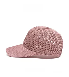 Detail view of pink knit mesh baseball cap featuring breathable openwork texture