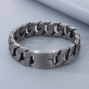 Detailed view of the vintage silver Cuban chain bracelet with intricate trident textures