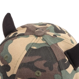 Detailed close-up of a camouflage baseball cap with unique 3D black devil horn accents