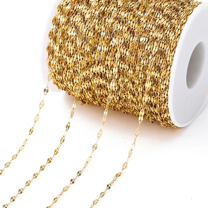 Detailed view of vacuum gold-plated stainless steel curb chain on white spool for jewelry making