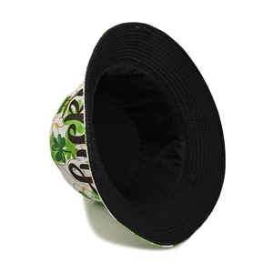 St. Patrick's Day bucket hat with green shamrocks and black beer typography print