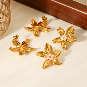 Detail of 18k gold plated stainless steel floral studs with pearl and pink bead accents